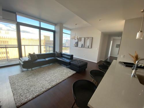 a living room with a couch and a table at Buckhead City Penthouse in Atlanta