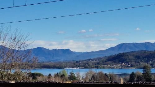a view of a lake with mountains in the background at The Lake - Casa Vacanza in Dormelletto