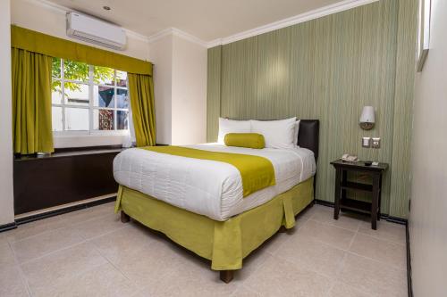 Ein Bett oder Betten in einem Zimmer der Unterkunft Hotel Ocean View