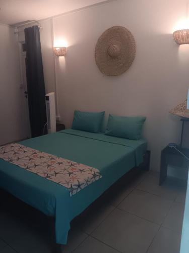 Cama o camas de una habitación en Residence le bijou mourouk rodrigues