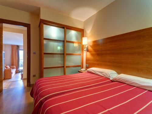 Cama o camas de una habitación en Apartamentos Astuy
