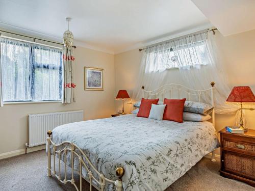 a bedroom with a bed and two windows at 1 bed property in Taunton 58511 in Taunton