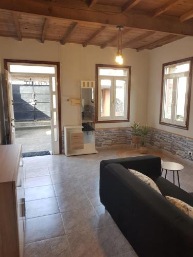 a living room with a couch and a table at Casa La Porriñesa in Porriño
