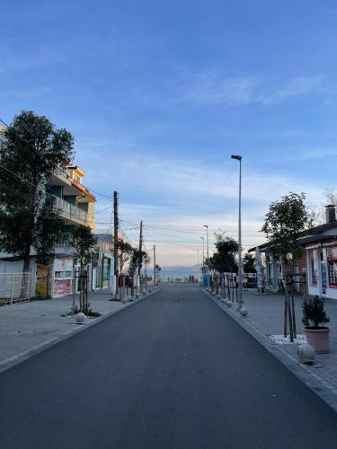 an empty street in a town with buildings at Home by the Sea MAIN STREET and POOL in Burgas