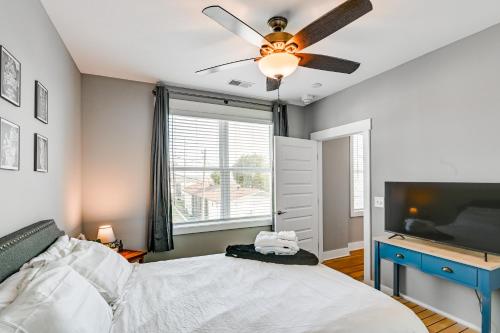 a bedroom with a bed and a ceiling fan at Modern Nashville Condo Walk to Local Breweries! in Nashville