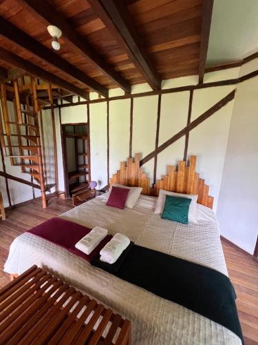 a bedroom with a large bed in a room at La Posada De Sauce in Sauce