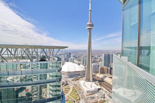 a view of the cn tower from the top of a building at Presidential 2+1BR Condo, Entertainment District (Downtown) w/ CN Tower View, Balcony, Pool & Hot Tub in Toronto