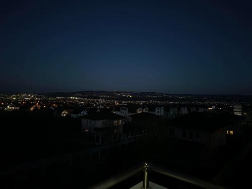 a view of a city at night at Ares Residence in Iaşi