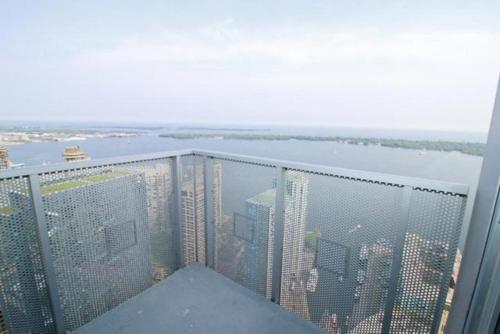 a view of a city from the top of a building at Presidential 2+1BR Condo, Entertainment District (Downtown) w/ CN Tower View, Balcony, Pool & Hot Tub in Toronto