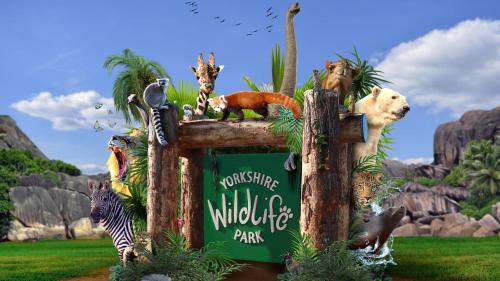 a sign for a wildlife park with animals on it at Moorgreen 