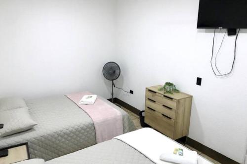 Casa Colibrí Apartamento 3 tesisinde bir odada yatak veya yataklar