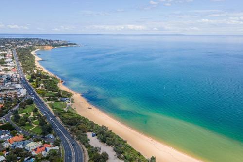an aerial view of a beach and the ocean at Sandringham Royale in Sandringham