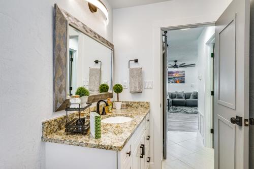 a bathroom with a sink and a mirror at Updated Punta Gorda Home about 1 Mi to Laishley Park! in Punta Gorda