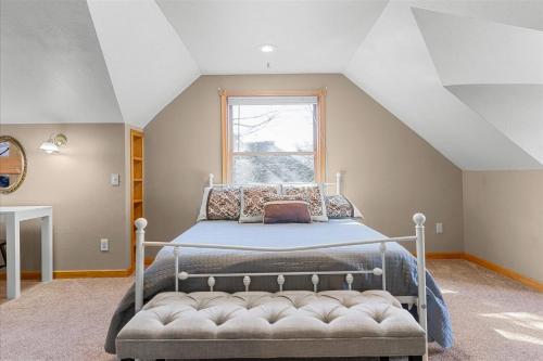 a bedroom with a bed and a window at C Street Charm in Coeur d'Alene