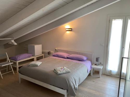 Postel nebo postele na pokoji v ubytování B&B il giardino dello Yogi
