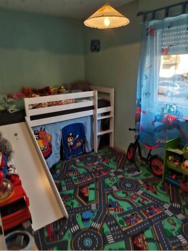 a childs bedroom with a bed with a toy train crib at Dream Word in Backnang