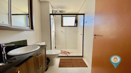 a bathroom with a shower and a sink and a toilet at ITA506T1 Beto Carrero e Praia ótima localização! in Piçarras