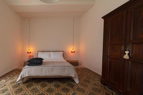 a bedroom with a bed with two pillows on it at Casa Vacanza Baragiola4 - Hotel San Giuseppe Group in Cernobbio