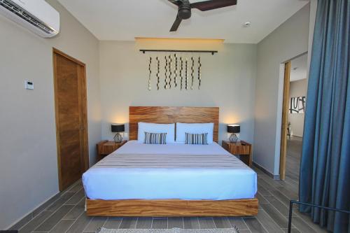 Ένα ή περισσότερα κρεβάτια σε δωμάτιο στο Nirú Ocean Suites by Binniguenda