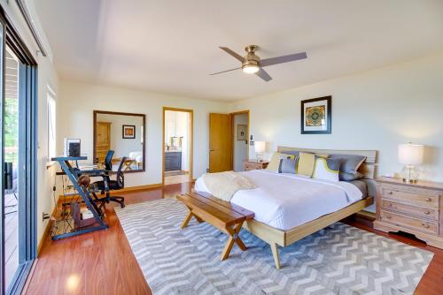 a bedroom with a bed and a table and a desk at Idyllic Kelseyville Home with 2 Decks and Views! in Kelseyville
