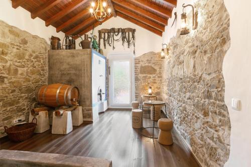 a wine tasting room with a barrel and a chandelier at Casal Velho in Salir de Matos
