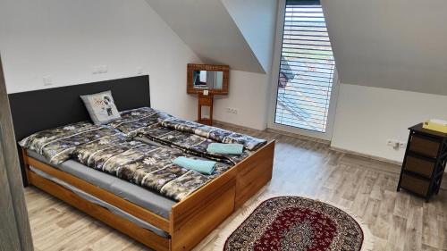 Postel nebo postele na pokoji v ubytování Apartmány - Vinařství Igor Herzán