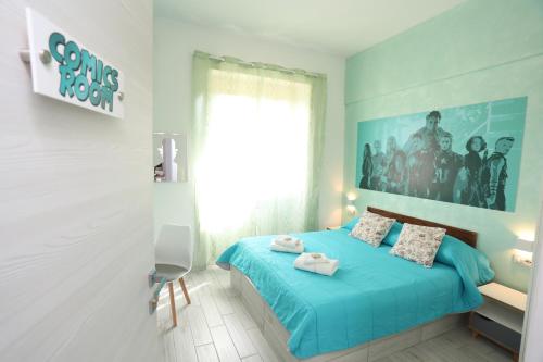 Ένα ή περισσότερα κρεβάτια σε δωμάτιο στο Cineroma Guesthouse