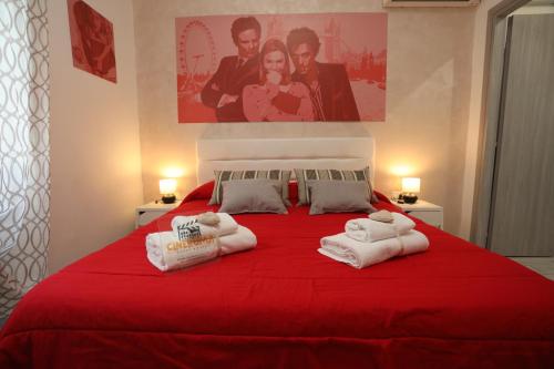 Ένα ή περισσότερα κρεβάτια σε δωμάτιο στο Cineroma Guesthouse