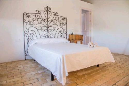 En eller flere senge i et værelse på La Aceitera