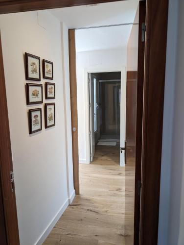 a hallway with a door leading into a room at Alojamientos Turisticos Isa i Toni in Sella