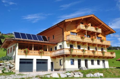a house with a solar panel on the roof at Ferienhaus für 14 Personen ca 65 qm in Mittersill-Jochbergthurn, Salzburger Land Wildkogel-Arena in Mittersill