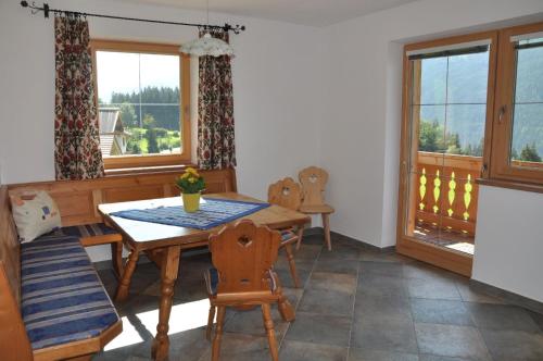 a dining room with a table and chairs and a window at Ferienhaus für 14 Personen ca 65 qm in Mittersill-Jochbergthurn, Salzburger Land Wildkogel-Arena in Mittersill