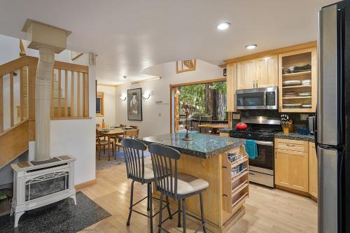 a kitchen with a counter and a stove top oven at Willowhaven in Monte Rio