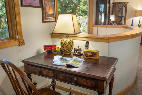 a table with a lamp on top of it at Willowhaven in Monte Rio
