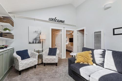 a living room with a couch and two chairs at Salmon House in Guerneville