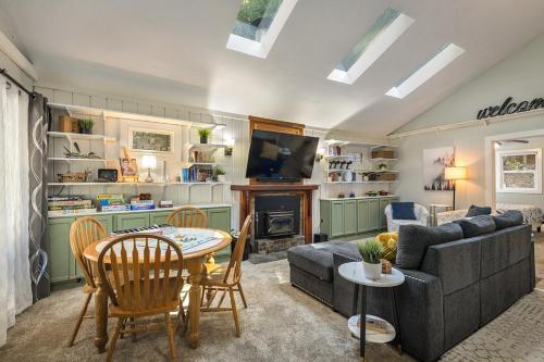 a living room with a couch and a table at Salmon House in Guerneville