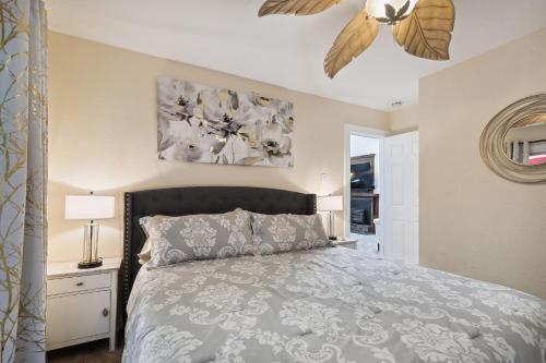 a bedroom with a bed and a ceiling fan at Salmon House in Guerneville
