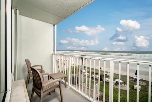 a balcony with a view of the beach at Perry's Ocean-Edge Resort in Daytona Beach