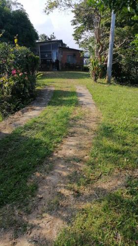 a dirt road in front of a house at Loma Bonita in Lérida