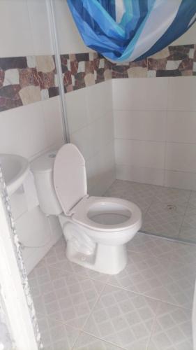 a bathroom with a white toilet in a room at Loma Bonita in Lérida