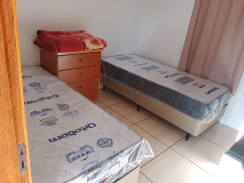 Katil atau katil-katil dalam bilik di Residencial Apoena