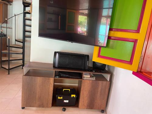 a tv on top of a entertainment center at La victoria in Marsella