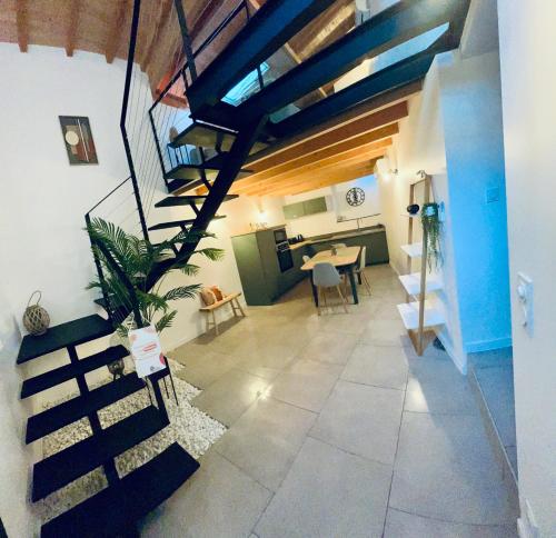 a staircase leading to a living room and a kitchen at Les Gites d'Andréa- Chez les Fifou in Surba