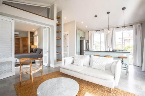 a living room with a white couch and a table at Steps From Ocean Couple's Getaway Private Villa in Playa Venao