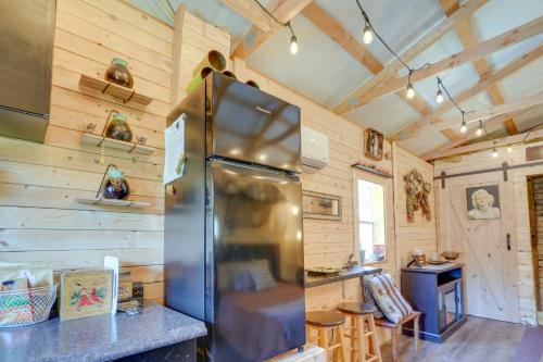 a kitchen with a refrigerator and wooden walls at Eagles Nest Studio in Rising Fawn Creek Access in Rising Fawn