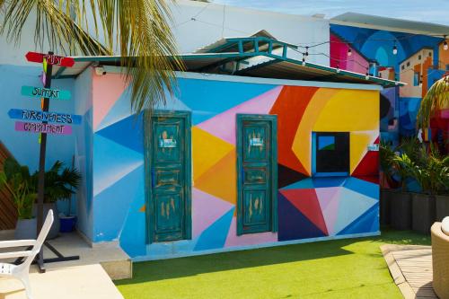a colorful mural on the side of a building at Coco Beach Cartagena in Cartagena de Indias