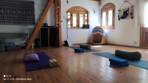 a room with a bunch of yoga mats on the floor at The Green House in Hurghada