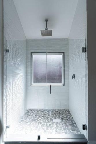 a bathroom with a shower and a window at ※ Cul-de-Sac Haven, Stylish & Tranquil ~ King Beds in Forney
