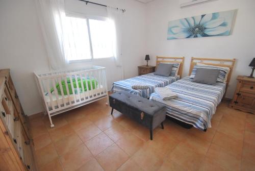 Ένα ή περισσότερα κρεβάτια σε δωμάτιο στο Villa Luna