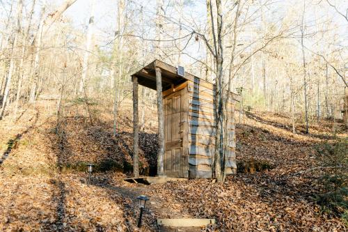an out house in the middle of the woods at Blythe Shoals Base Camp in Cleveland